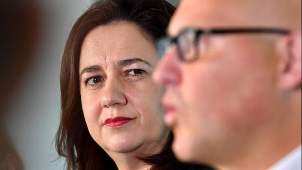 Annastacia Palaszczuk looks on while Curtis Pitt speaks