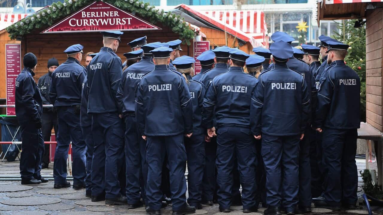 Police officers standing by a stall near the site of the attack at the Christmas market at Breitscheidplatz in Berlin, Germany.