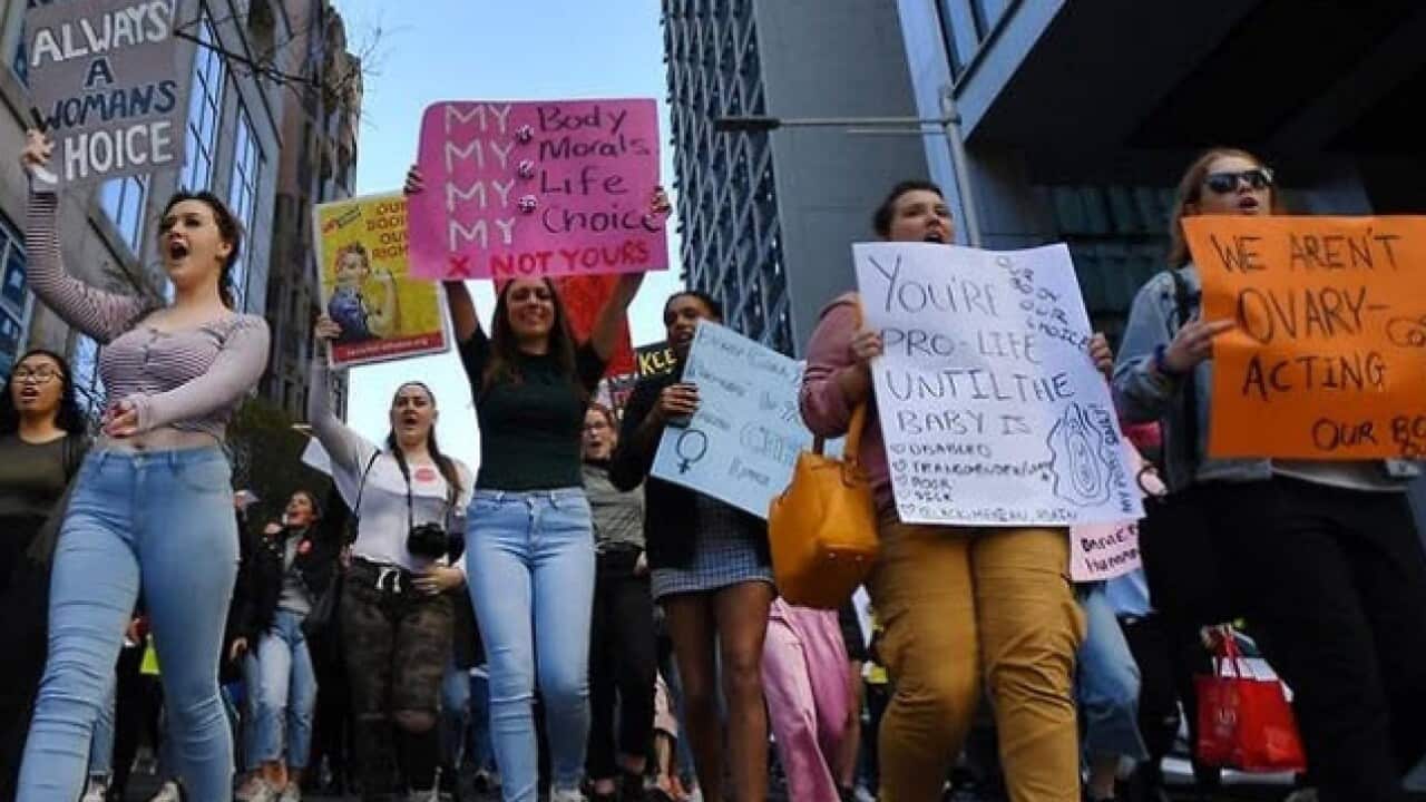 Protesters have marched in Sydney against abortion laws in the United States and NSW. (AAP)