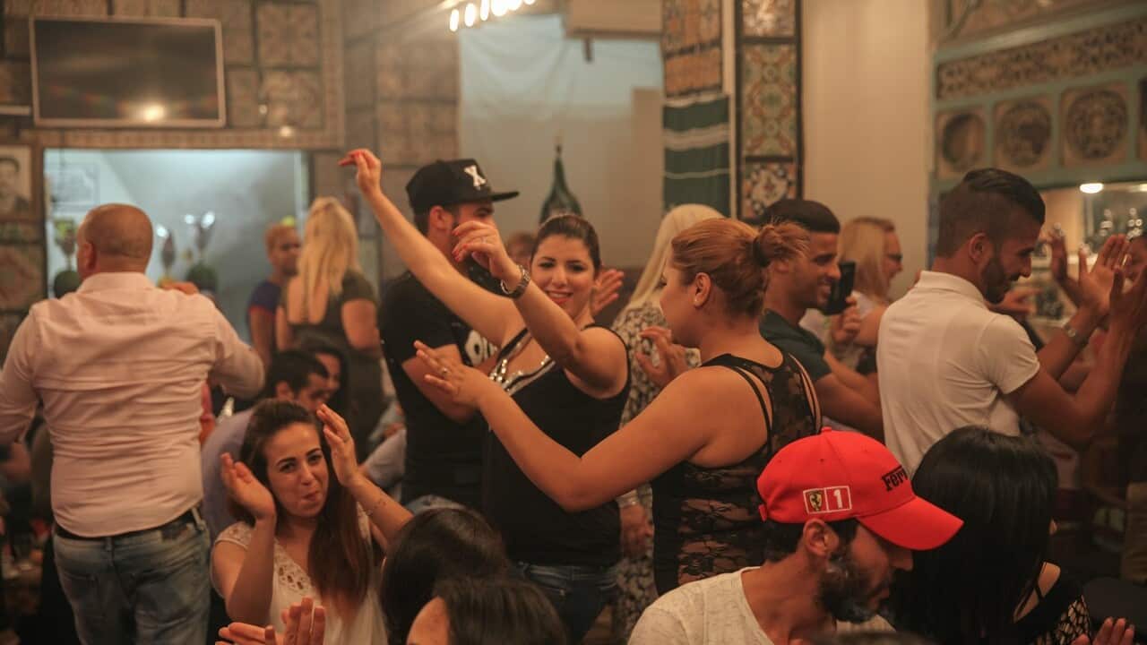 People dance in the Medina of Tunis during the holy month of Ramadan