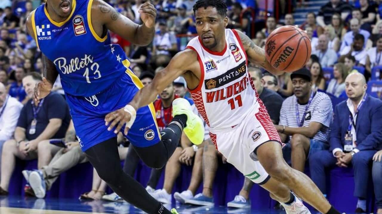 Bryce Cotton of the Wildcats with the ball.