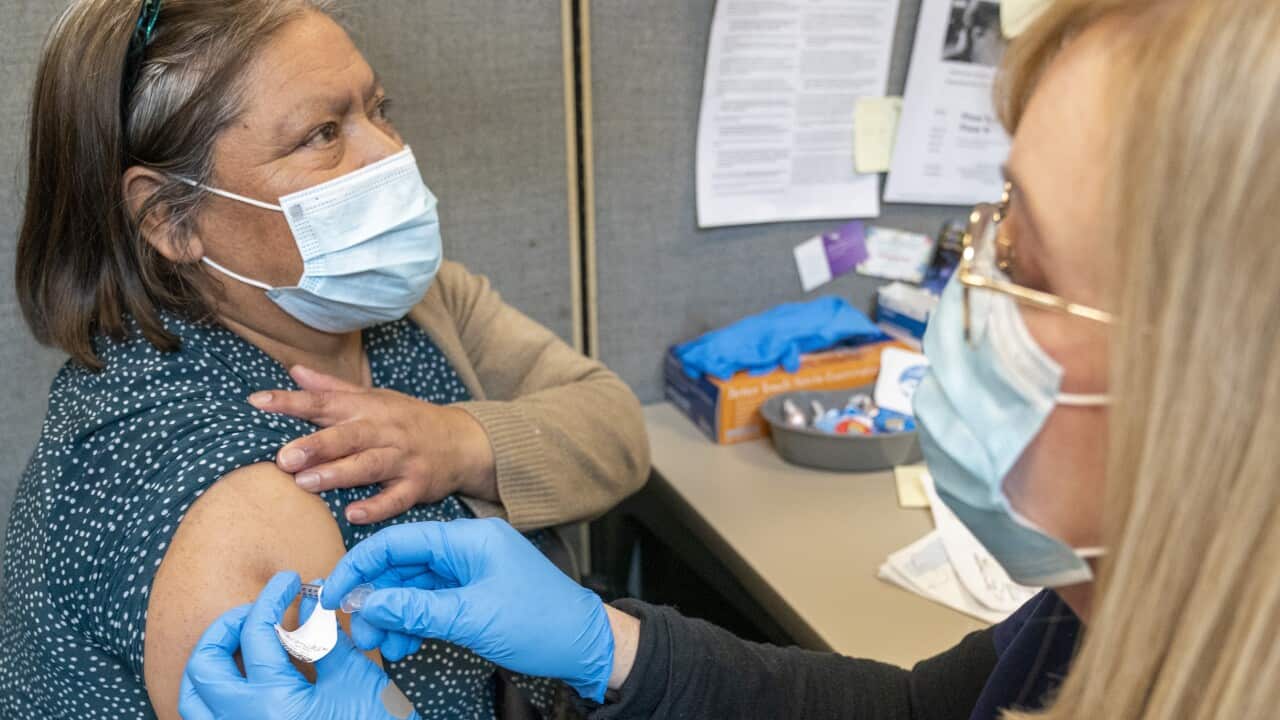A Registered Nurse gives the first dose of the coronavirus vaccine to a patient in New York on Thursday, 18 February, 2021.