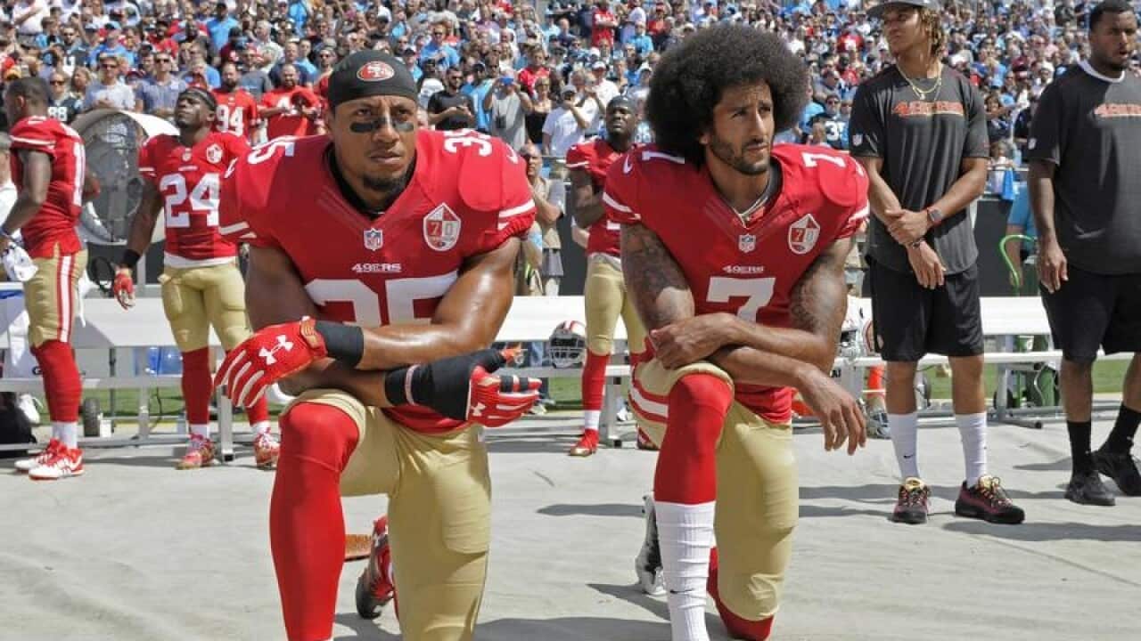 Former 49ers' Colin Kaepernick (R) and Eric Reid have settled their lawsuits against the NFL.