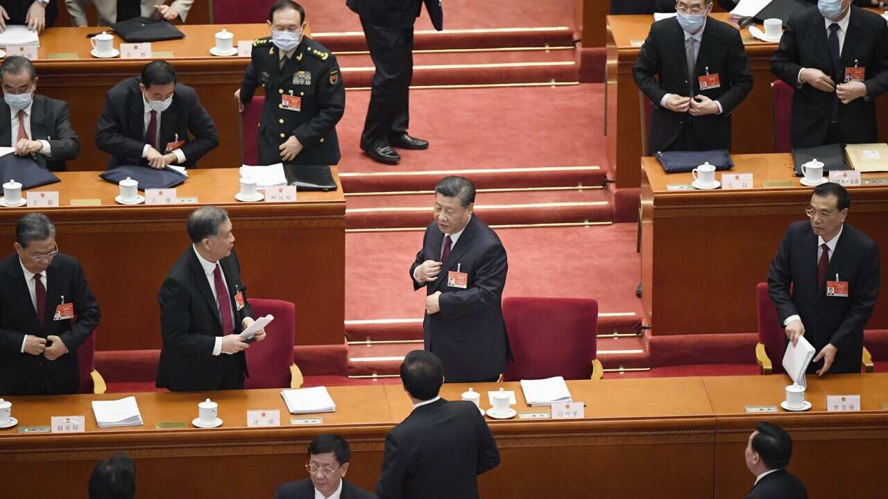 Chinese President Xi Jinping (centre) and Premier Li Keqiang (far right) at the opening ceremony of the National People's Congress.