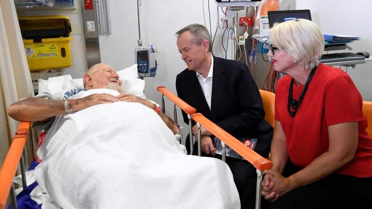 Labor's Bill Shorten and Elida Faith beside hospital patient in Cairns