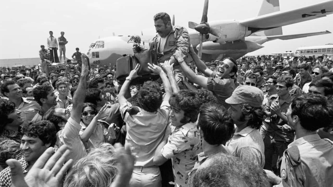 Rescue Pilot Lifted on Shoulders