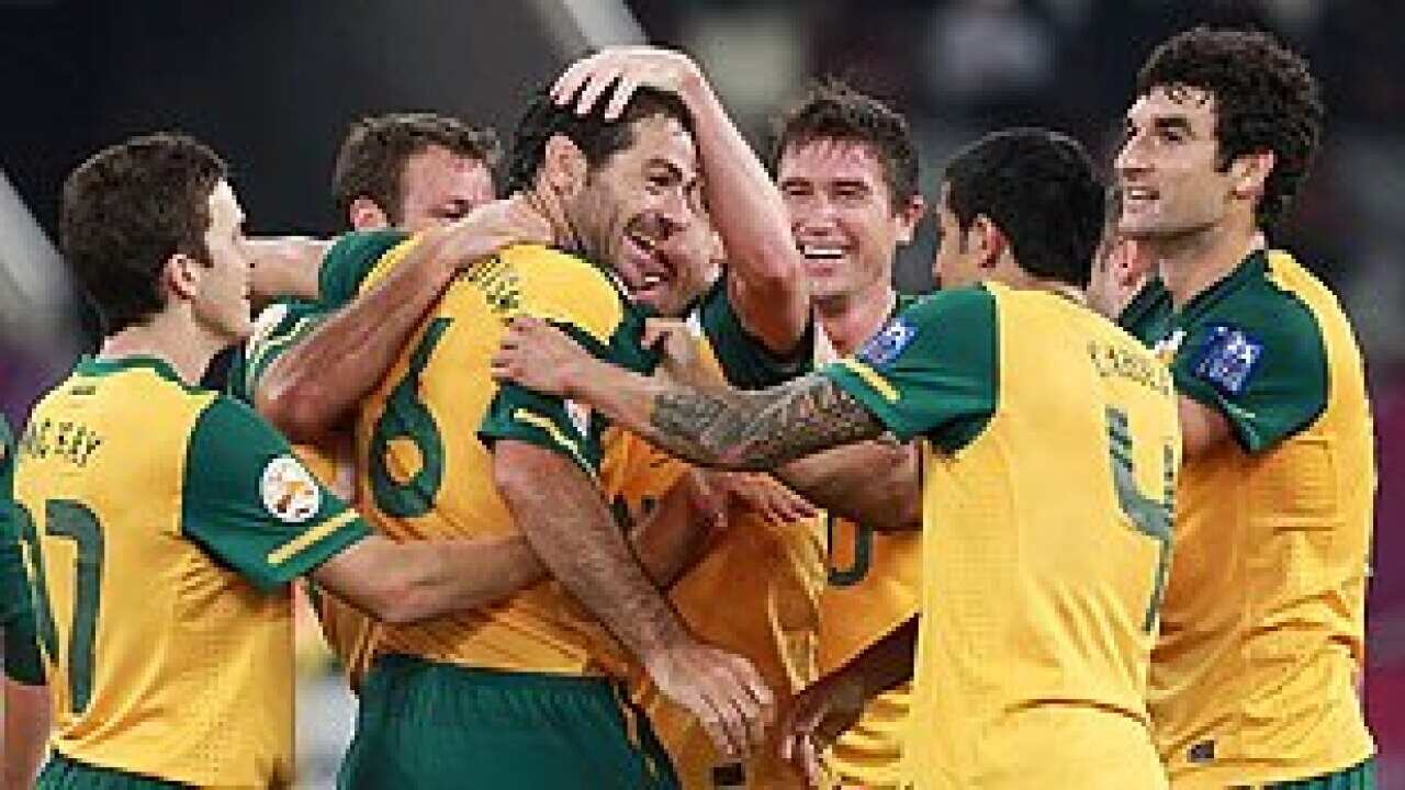Australia's players celebrate a goal against Uzbekistan in Qatar