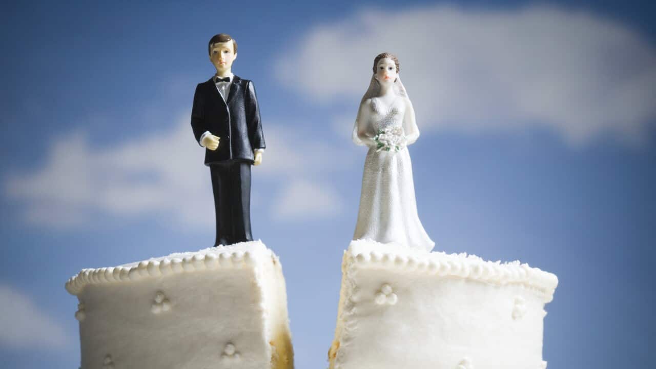 Wedding cake visual metaphor with figurine cake toppers