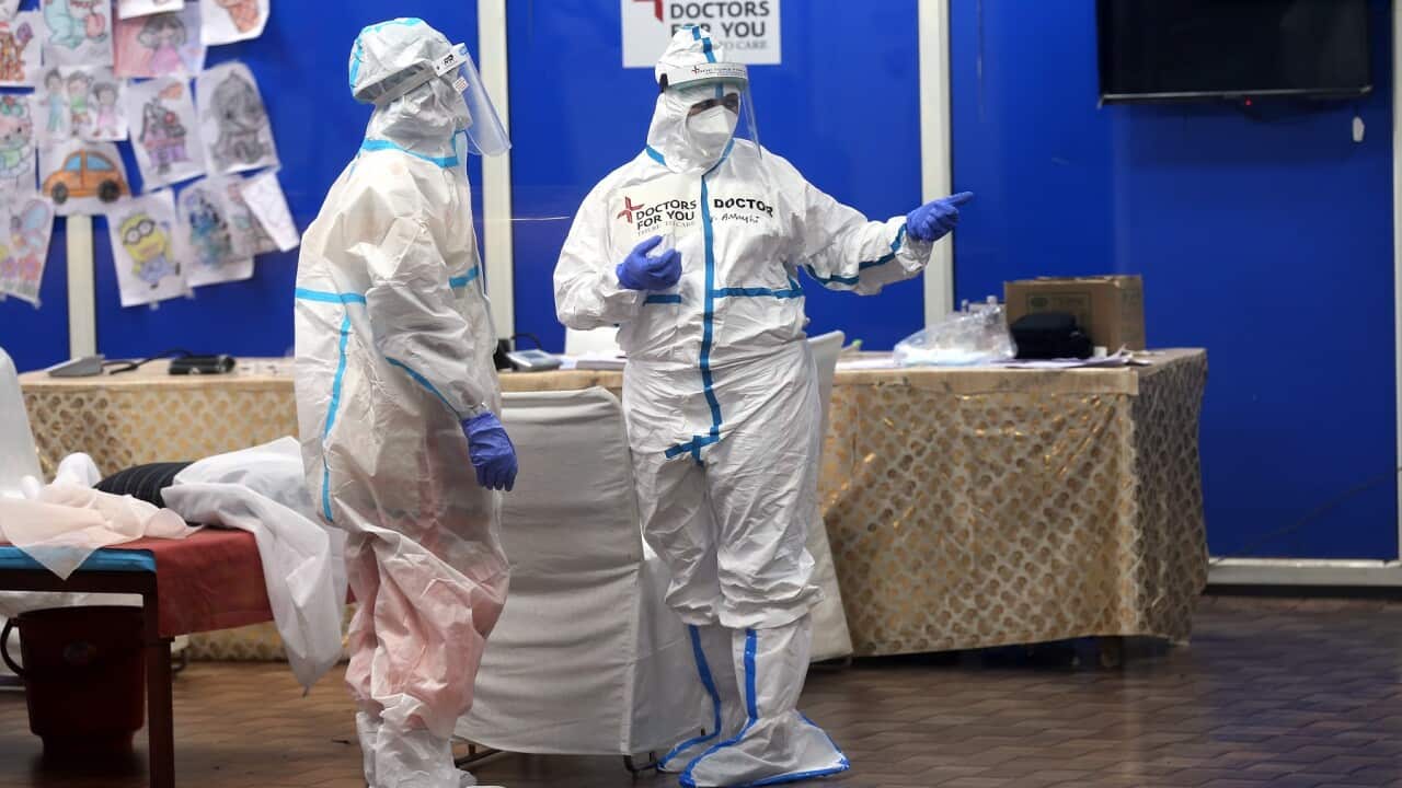 An Indian doctor covered in Personal Protective Equipment at a COVID 19 care centre and isolation ward