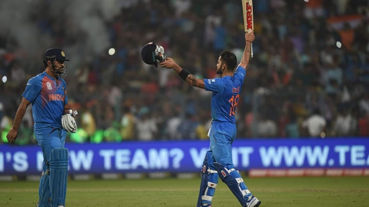 India's Virat kohli celebrates victory with Captain Dhoni