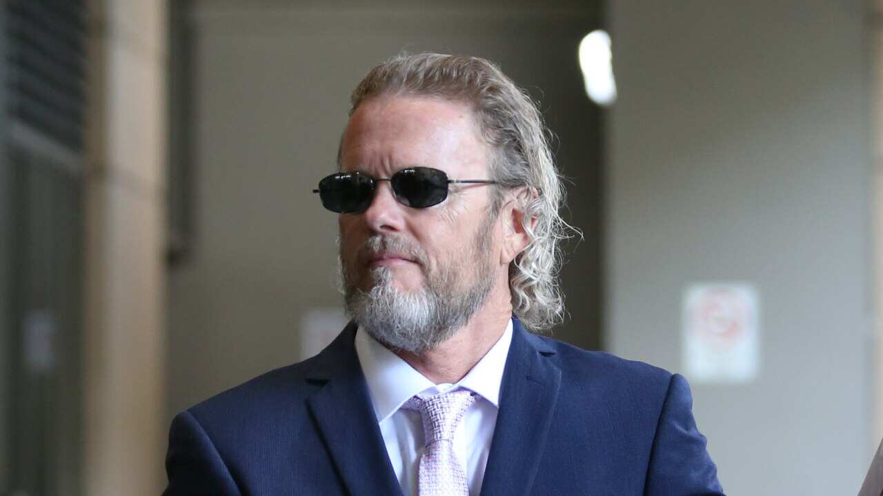 Australian actor Craig McLachlan partner Vanessa Scammell arrive at the Melbourne Magistrates Court in Melbourne, Wednesday, March 11, 2020. (AAP Image/David Crosling) NO ARCHIVING