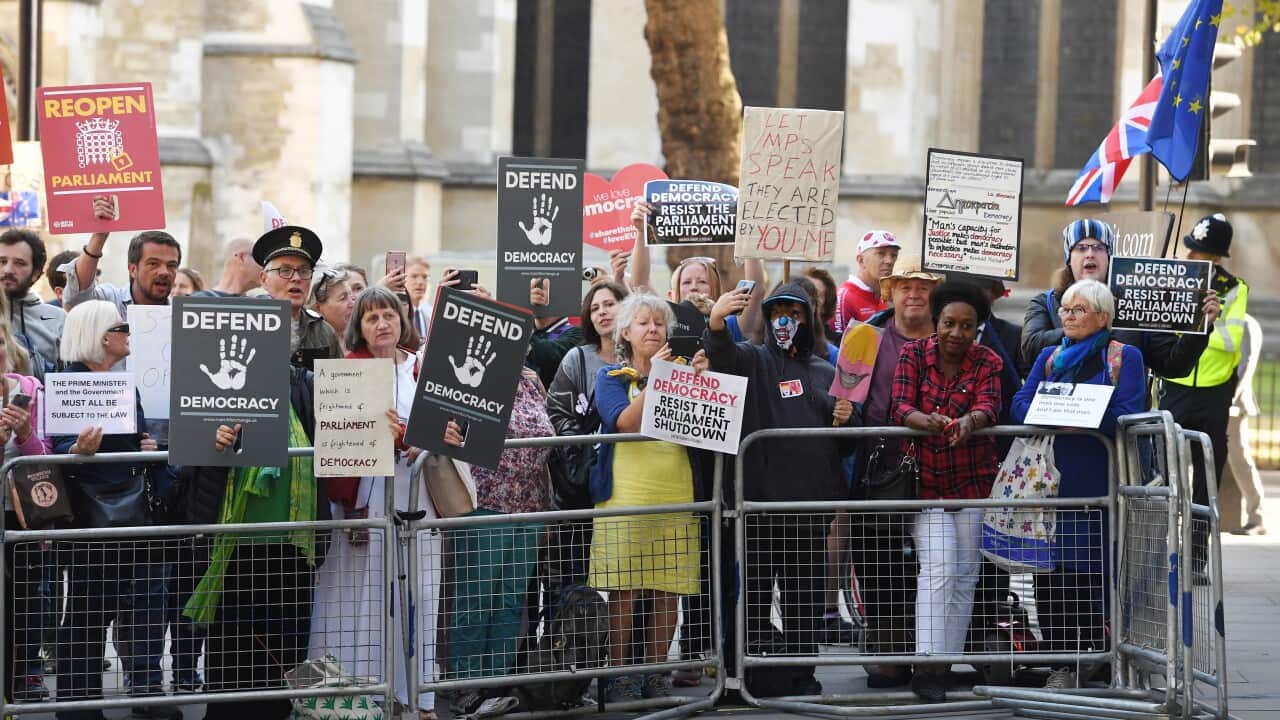 Protesters gather outside of the Supreme Court during a hearing on the prorogation of parliament.