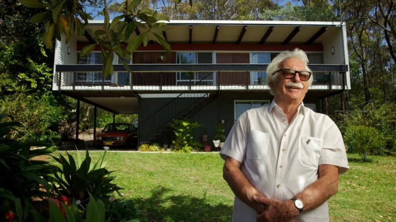 Nino Sydney in front of his Beachcomber house