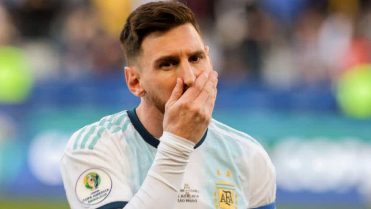 Lionel Messi receives a red card during Argentina's win over Chile at the Copa America