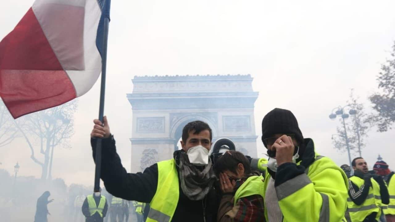 Yellow vest protest against rising fuel taxes in Paris.