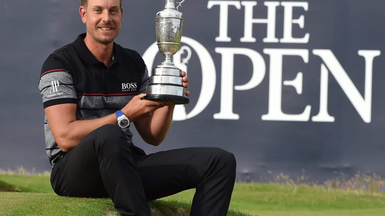 Henrik Stenson of Sweden holds the Claret Jug