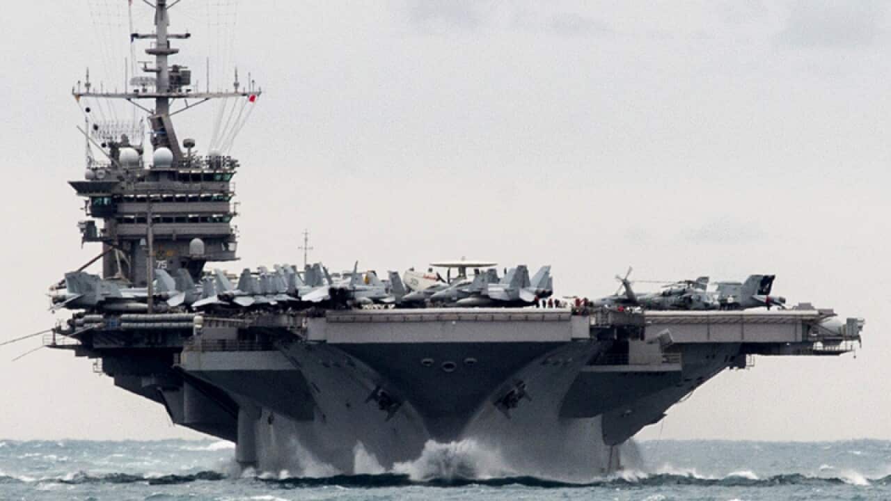 The USS Harry S. Truman transits the Strait of Hormuz