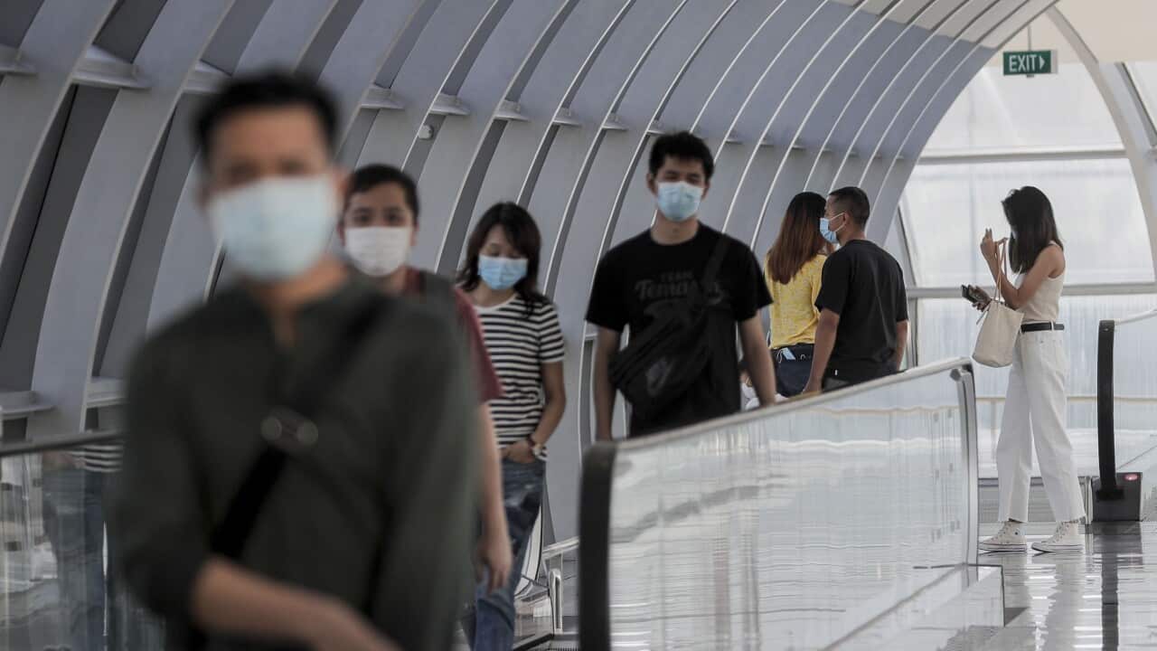 Visitors head towards the Jewel Changi Airport mall in Singapore, 30 July 2020.