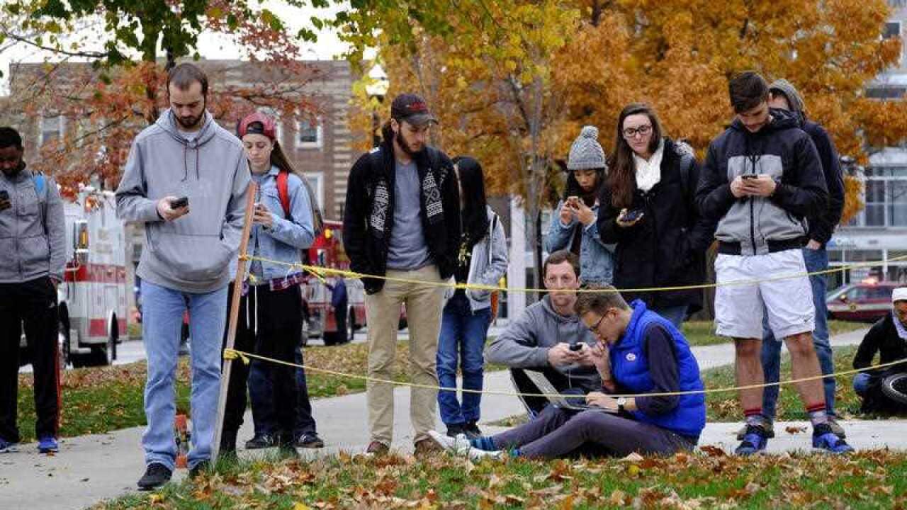 Students gather near the scene of an attack on the campus at Ohio State University on Monday, Nov. 28, 2016, in Columbus, Ohio.