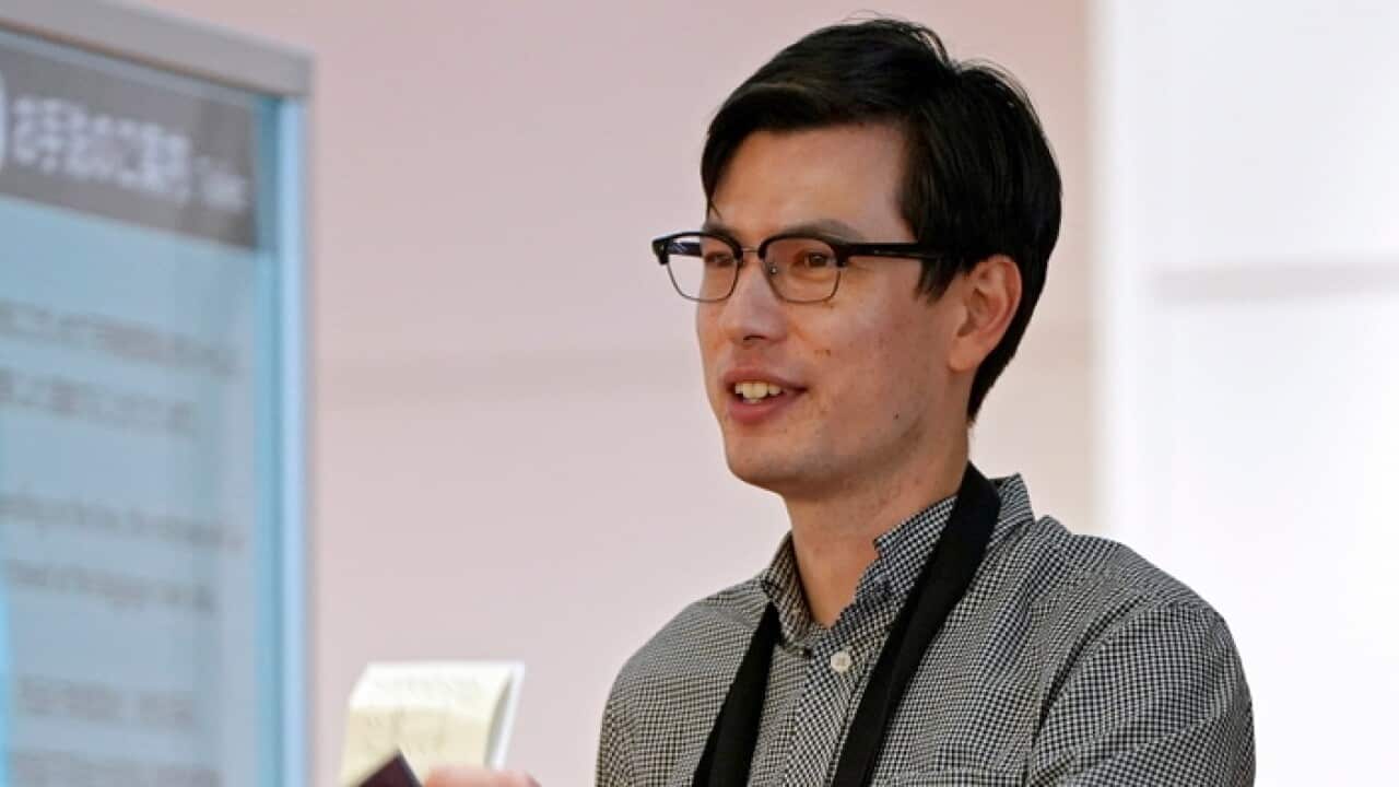 Alek Sigley arrives at Haneda International airport in Tokyo, Japan