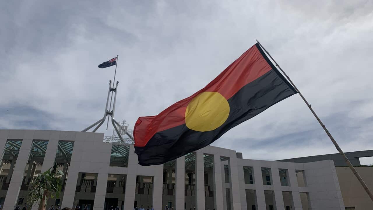 The Aboriginal flag in from of Australian Parliament House
