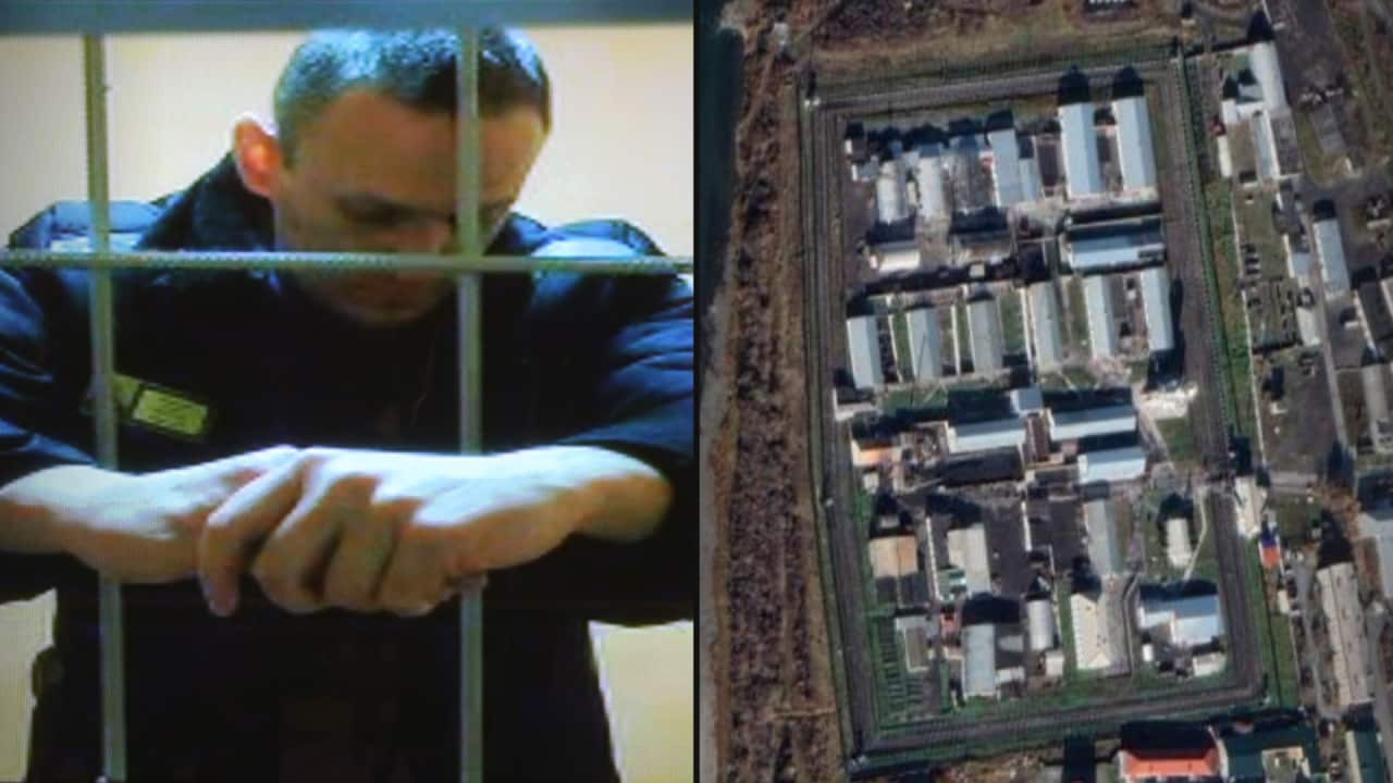 A split image. On the right is a man behind bars appearing on a screen. On the right is an aerial view of a prison.