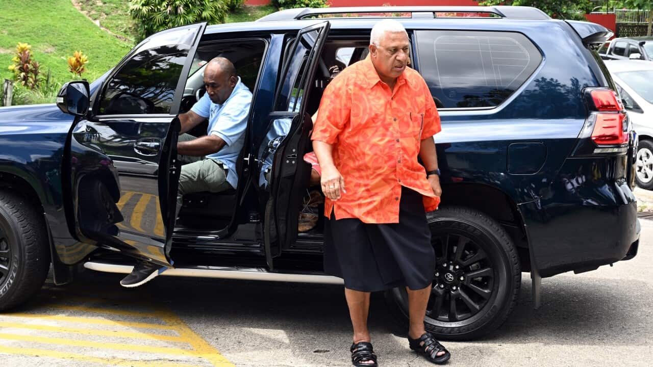 Fiji’s Prime Minister and FijiFirst leader Frank Bainimarama arrives at a polling station during the Fijian election campaign in Suva on 14 December 2022.