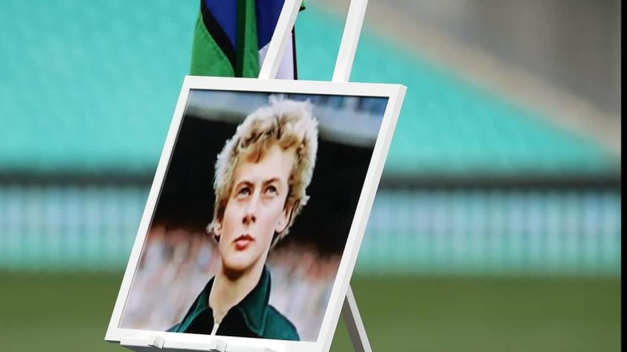 Image of Betty Cuthbert is displayed during a State Memorial Service.
