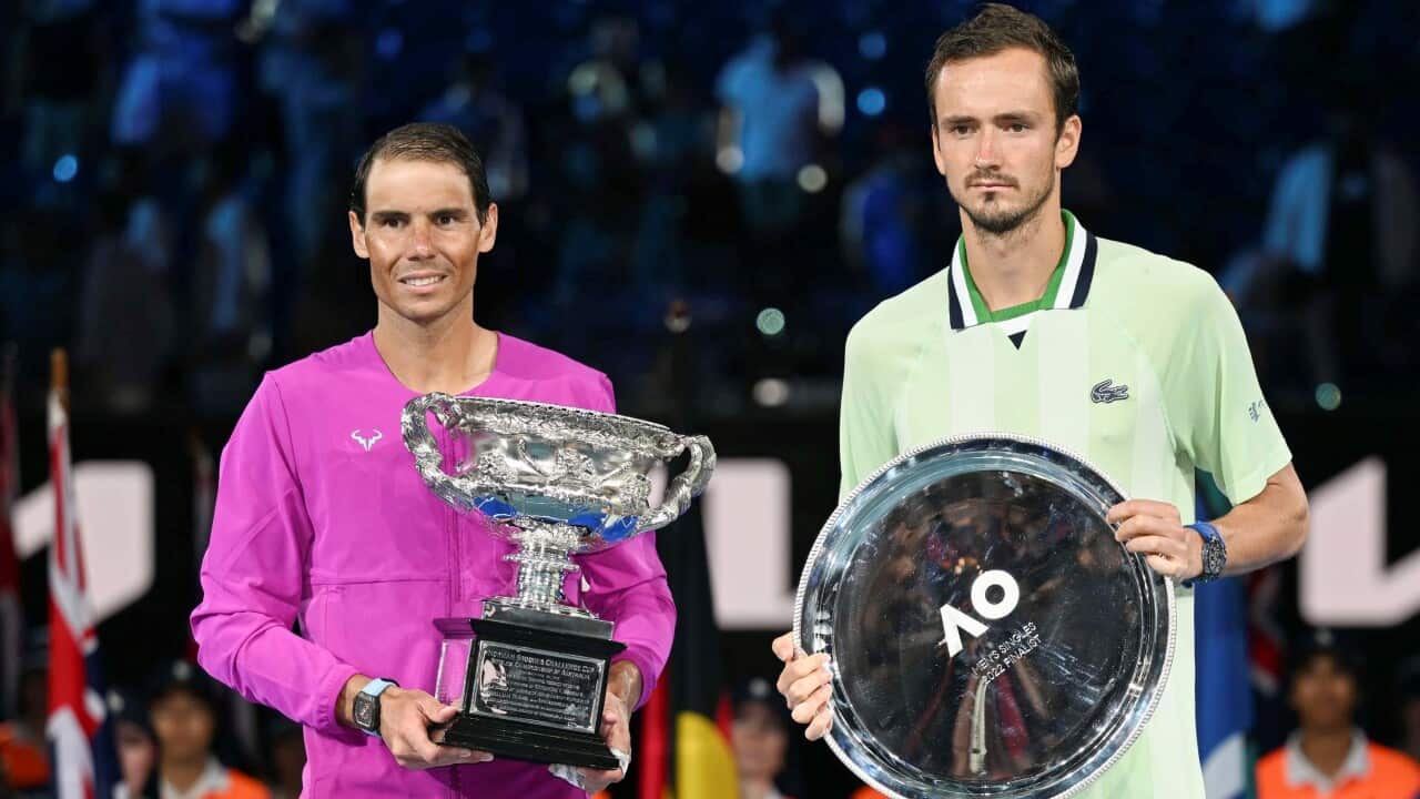 Rafael Nadal of Spain poses with the trophy after defeating Daniil Medvedev of Russia in the men's singles final at the Australian Open tennis tournament
