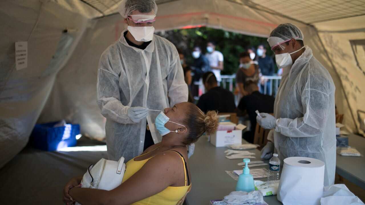 A woman is tested for COVID-19 at a mobile testing centre in Marseille, France, Thursday.