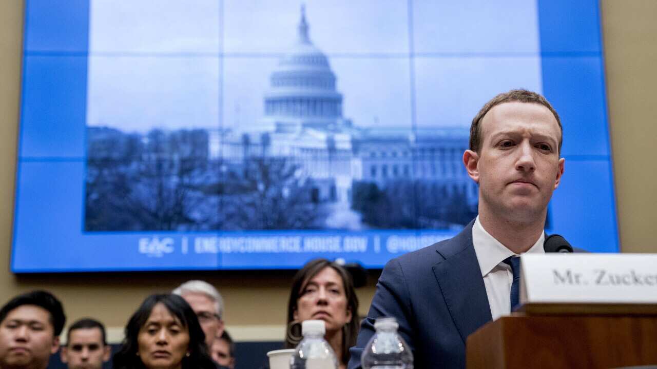Facebook CEO Mark Zuckerberg pauses while testifying before a House Energy and Commerce hearing on Capitol Hill in Washington.