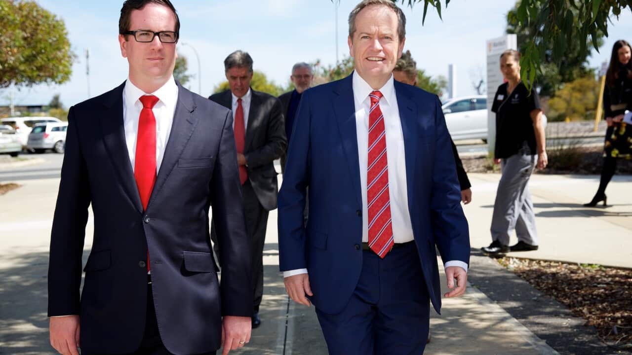 Federal Opposition Leader Bill Shorten walks with Labor candidate for Canning Matt Keogh