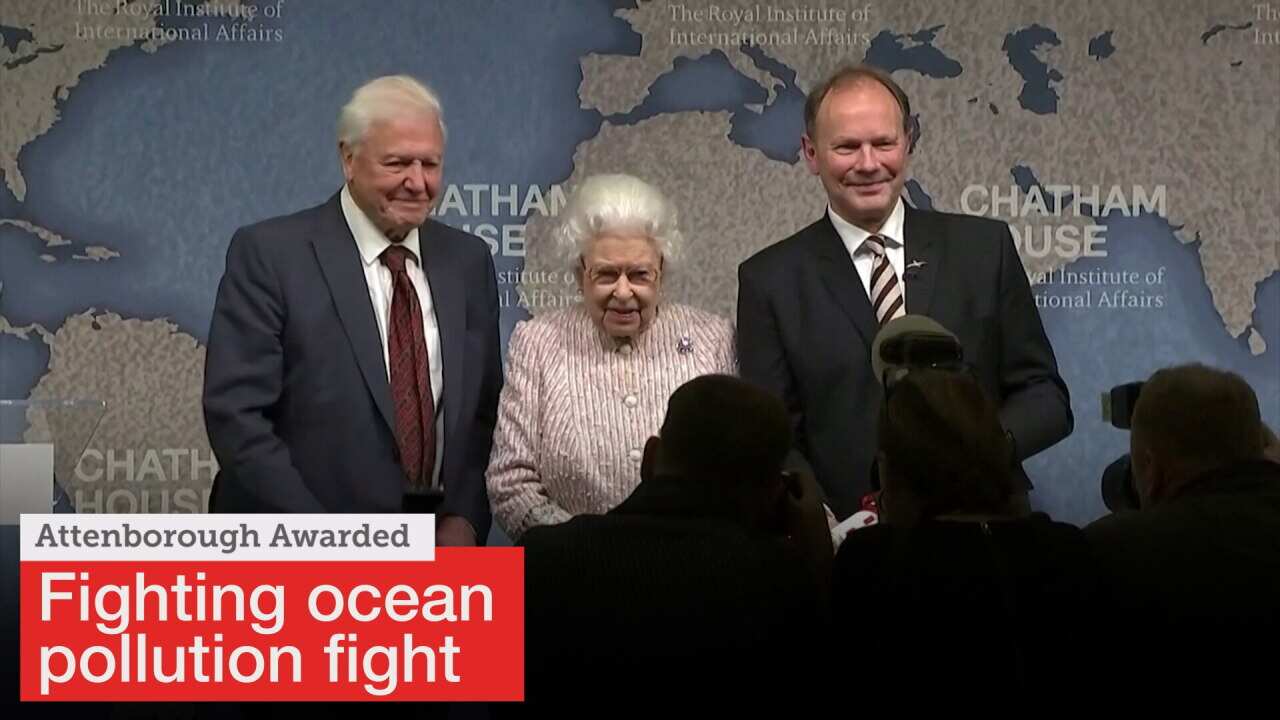 Queen Elizabeth presents naturalist Attenborough with award for ocean pollution fight