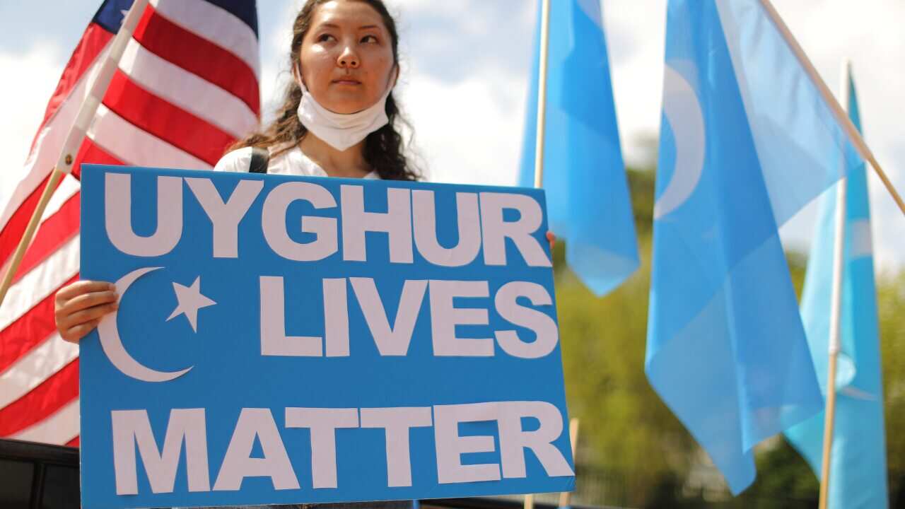 Uighur supporters rally outside the White House to urge the United States.