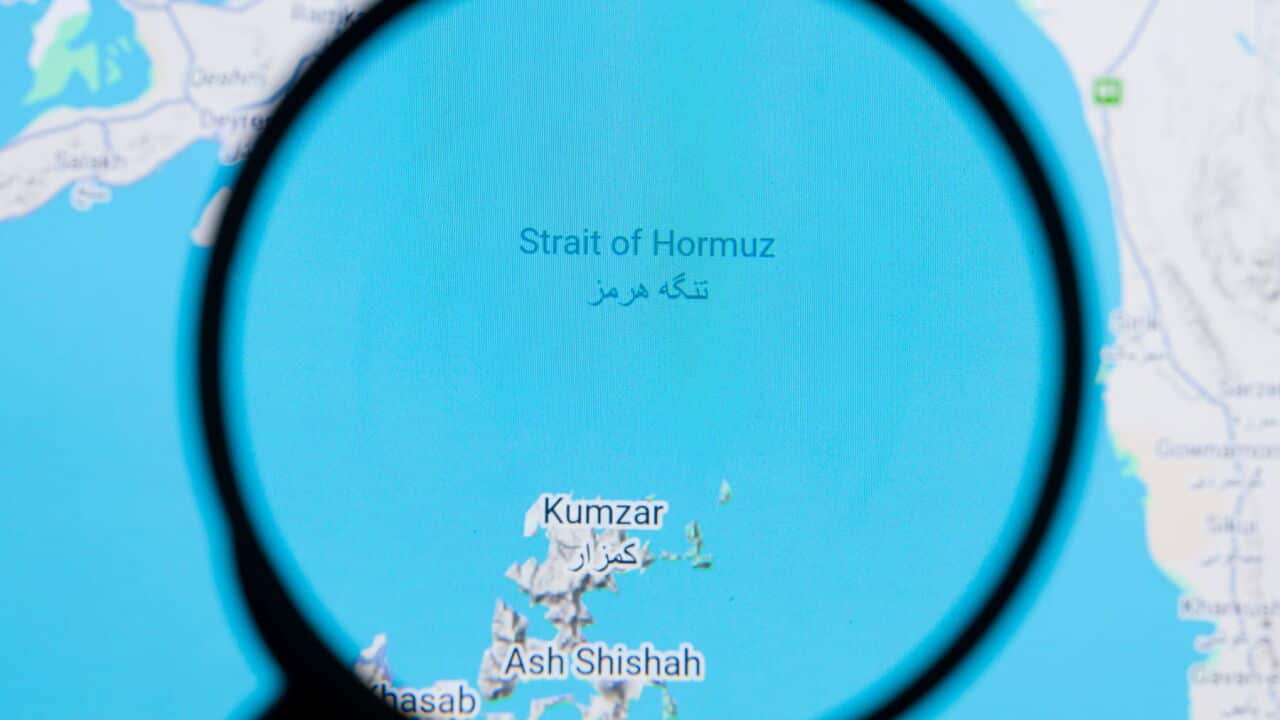 The Strait of Hormuz pictured through a magnifying glass, is seen in this photo illustration (Jonathan Raa Sipa USA) .jpg