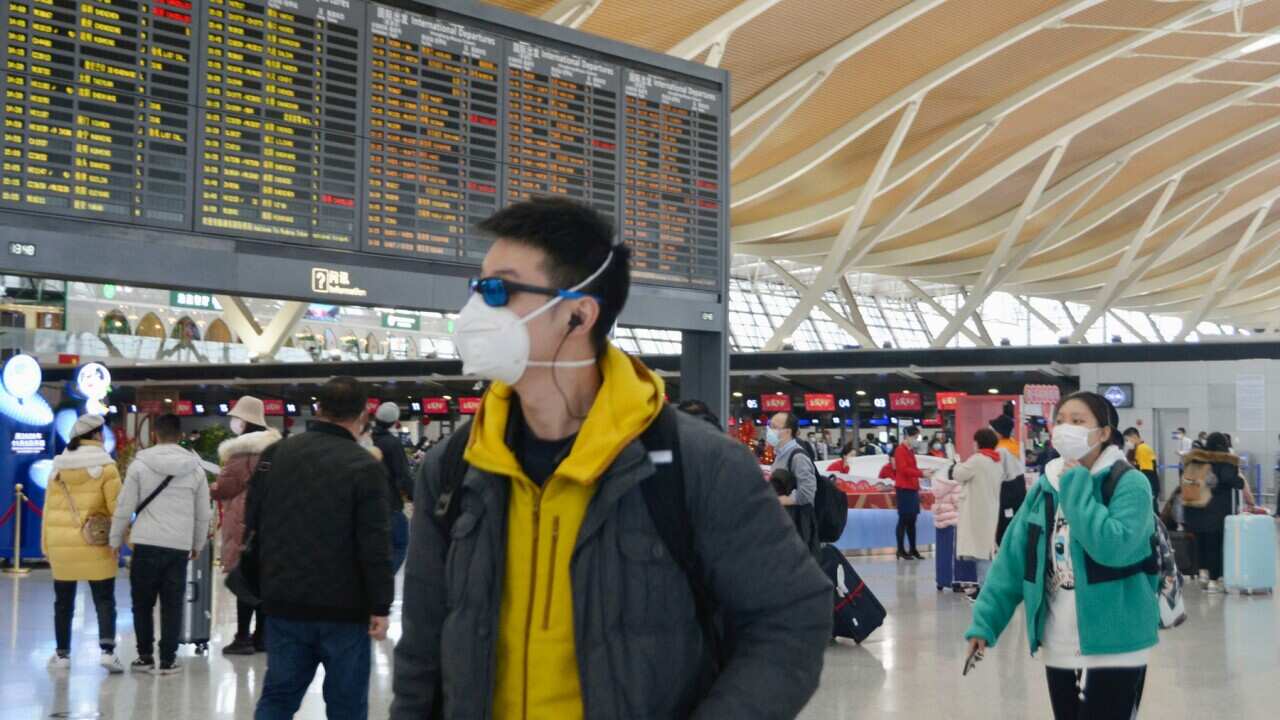 A man wears a mask at Shanghai Pudong International Airport