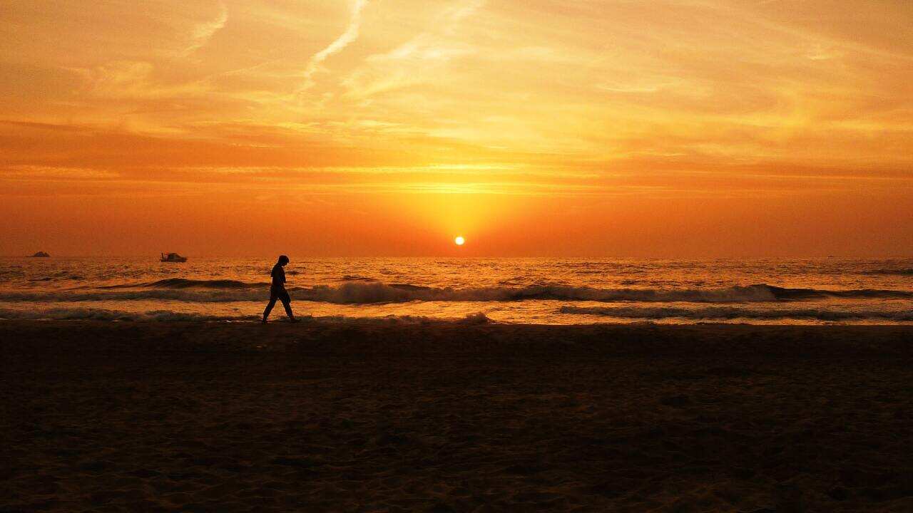 Walking alone on a beach