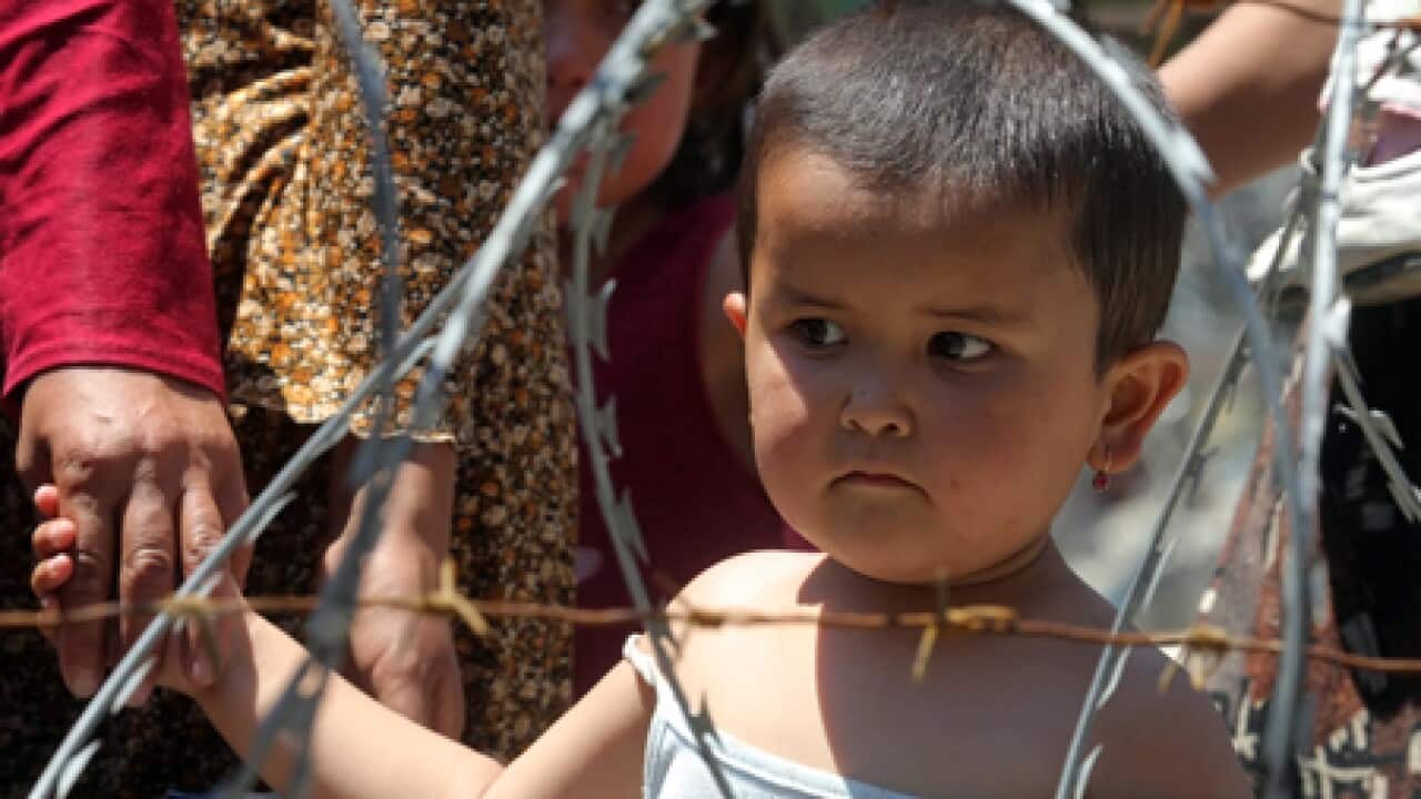 kyrgyz_refugee_kid_L_100621_aap_1182538853