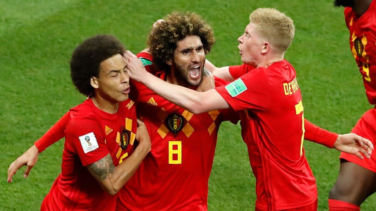 Belgium's Marouane Fellaini, center, celebrates with teammates after scoring his second side goal during the round of 16 match between Belgium and Japan 