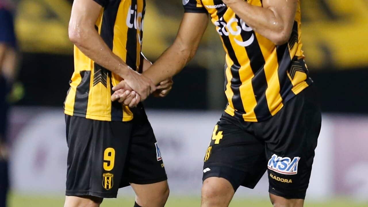 Rodrigo Lopez, left, and teammate Juan Patino