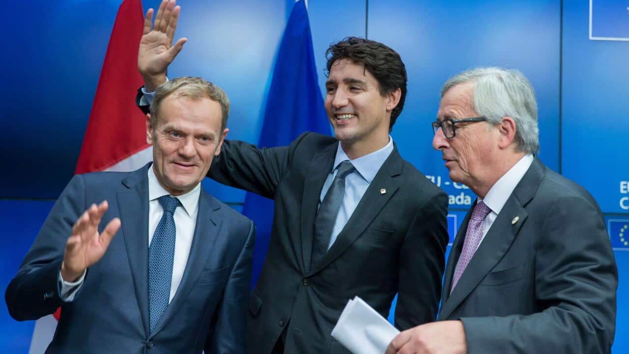 President of the European Commission, Jean-Claude Juncker (R), Canadian Prime Minister Justin Trudeau (C) and EU Council President Donald Tusk (L)