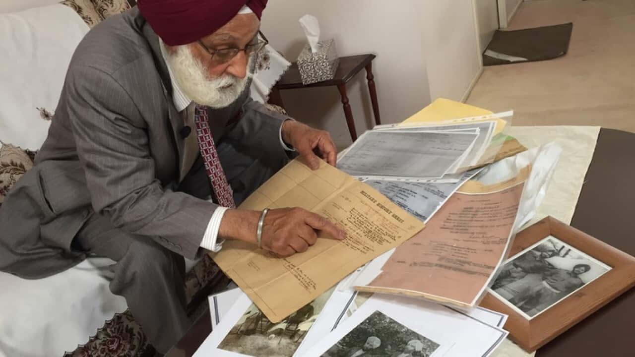 Balbir Singh Banwait looking through his father's documents