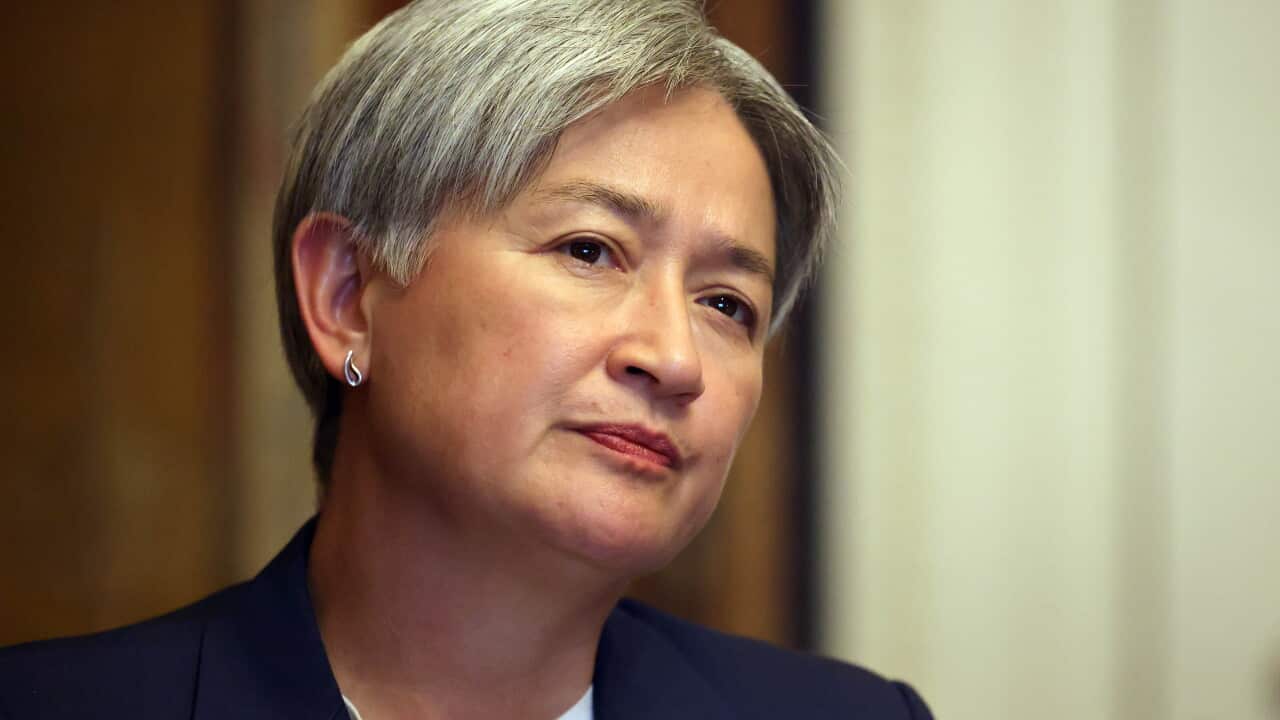 A woman in a suit close up