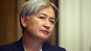 A woman in a suit close up