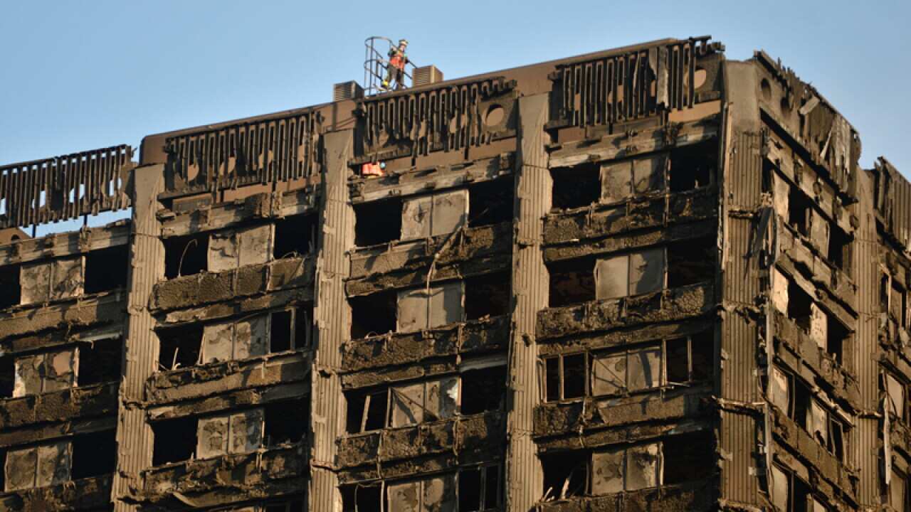Rescue officers from London Fire Brigade on the roof of Grenfell Tower