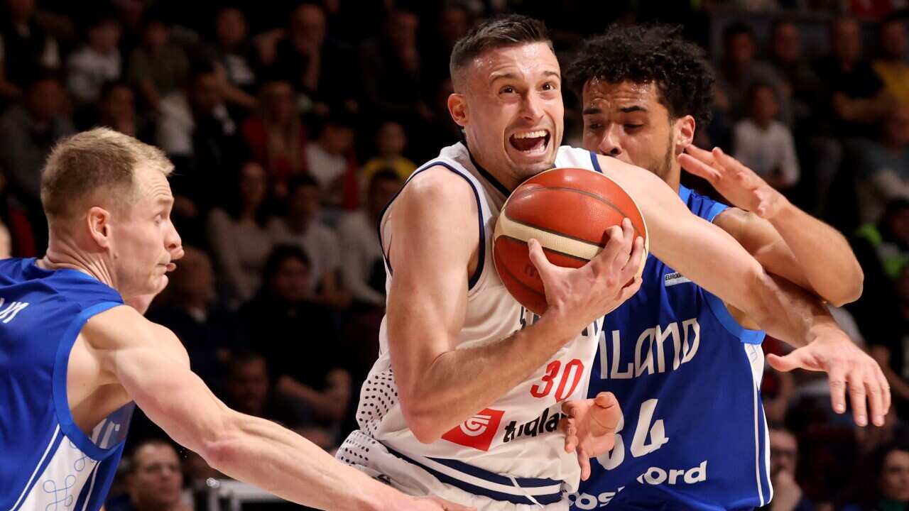 Serbia's Aleksa Avramovic (C) in action against Finland's Sasu Salin (L) and Jacob Grandison (R) during the FIBA EuroBasket 2025 Qualifiers basketball game between Serbia and Finland, in Belgrade
