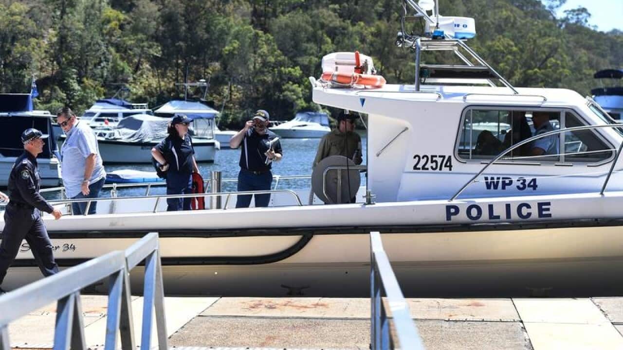 A NSW Water Police boat prepares to inspect the crash site.