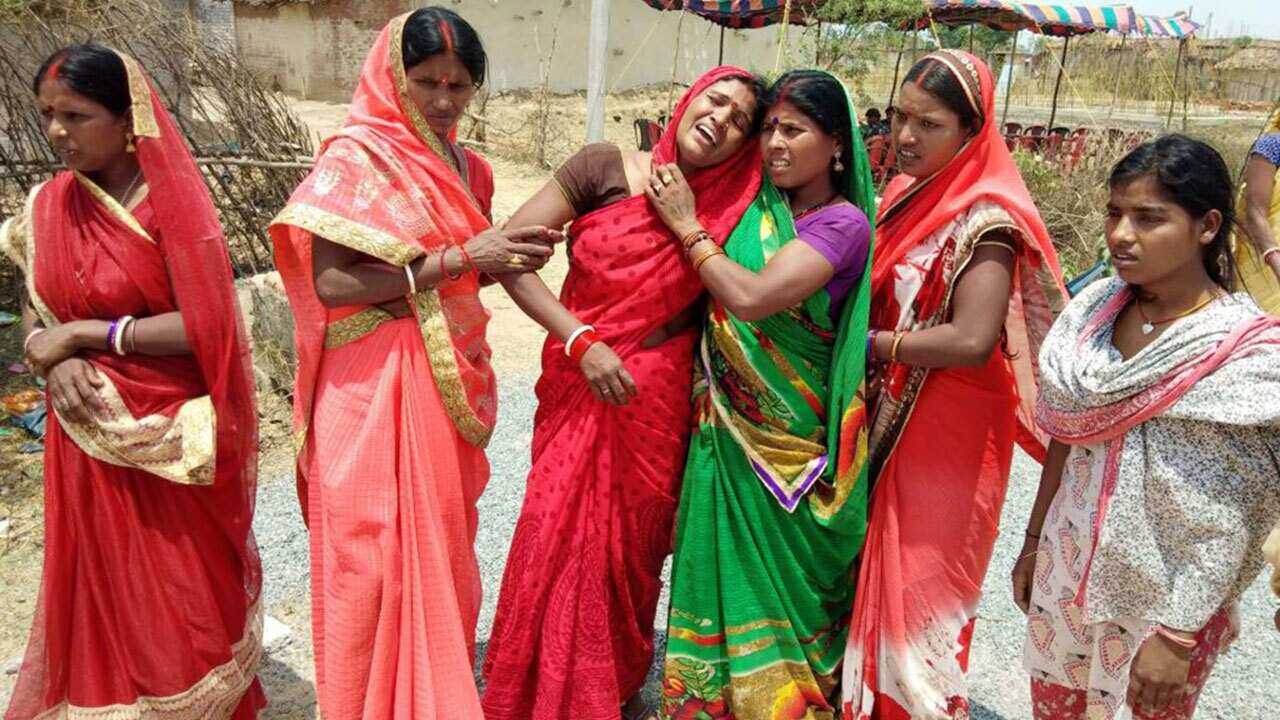 Indian relatives mourn following the rape and murder of a 16-year-old girl on May 3