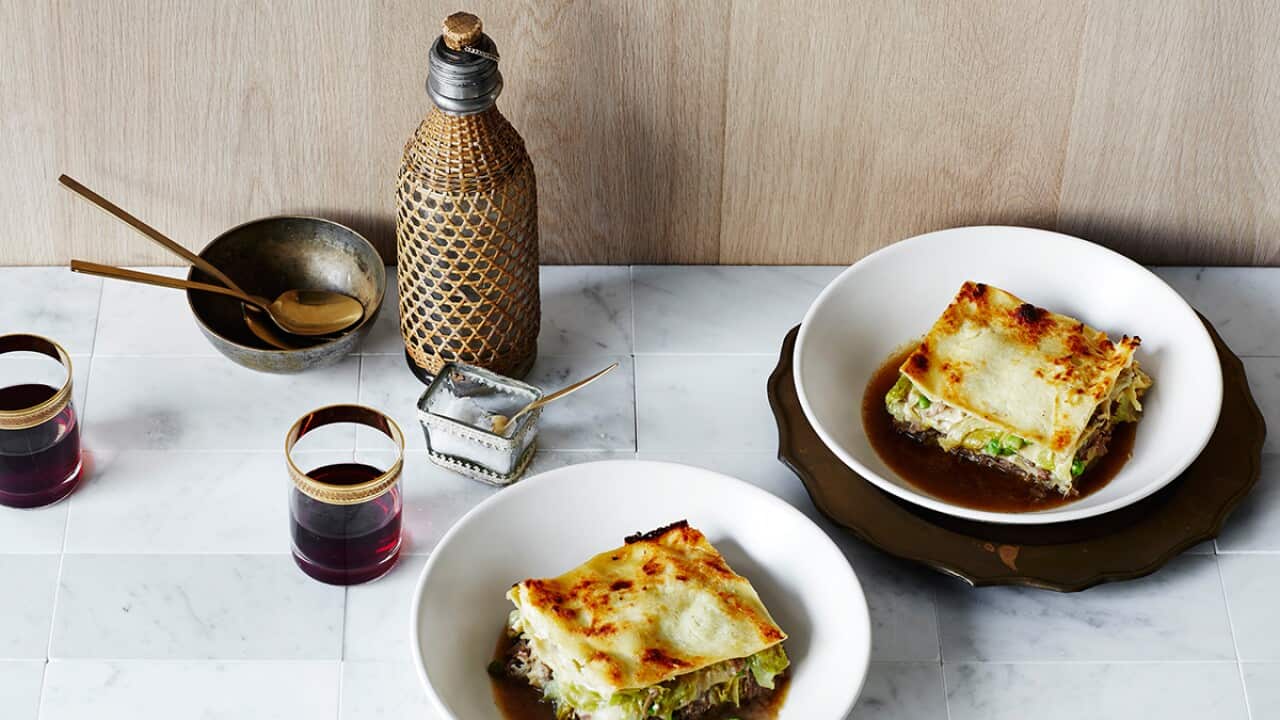 Goat ragu lasagne with peas and iceberg
