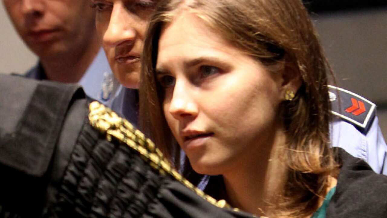 amanda_knox__verdict_success_0410_b_getty_1264593051